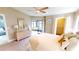 Relax in this bedroom with serene decor, dresser, and a tranquil view of the patio and canal at 3830 Bal Harbor Blvd # 5, Punta Gorda, FL 33950