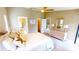 Bedroom featuring beach decor, dresser, and serene accents, with easy access to the bathroom and walk-in closet at 3830 Bal Harbor Blvd # 5, Punta Gorda, FL 33950