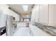 Well-equipped kitchen featuring stainless steel appliances, ample storage, and stylish countertops at 3830 Bal Harbor Blvd # 5, Punta Gorda, FL 33950