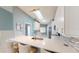 Modern kitchen with stainless steel appliances, a breakfast bar, and white cabinetry at 3830 Bal Harbor Blvd # 5, Punta Gorda, FL 33950
