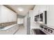 Beautiful kitchen featuring stainless steel appliances, elegant white cabinets and a sleek design at 3830 Bal Harbor Blvd # 5, Punta Gorda, FL 33950