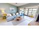 Cozy living room with a comfortable couch and sliding doors for relaxing and enjoying water views at 3830 Bal Harbor Blvd # 5, Punta Gorda, FL 33950