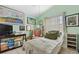 Inviting bedroom with tile flooring, ceiling fan, and a large window providing plenty of natural light at 483 Winwood Ct, Port Charlotte, FL 33954