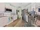 Well-lit kitchen with white cabinetry, stainless steel appliances, granite countertops, and decorative backsplash at 483 Winwood Ct, Port Charlotte, FL 33954