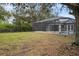 Landscaped backyard showing the screened in pool, providing a relaxing outdoor oasis at 5452 Montego Ln, Port Charlotte, FL 33981