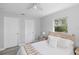 Bright bedroom with a queen bed, bedside tables, and two closets for ample storage at 5452 Montego Ln, Port Charlotte, FL 33981