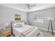 Cozy bedroom featuring a queen bed, neutral decor, and natural light from two windows at 5452 Montego Ln, Port Charlotte, FL 33981