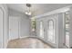 Entry way featuring tile flooring, decorative glass front doors, and a view of the pool through a window at 5452 Montego Ln, Port Charlotte, FL 33981