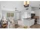 Open concept features kitchen, living room, dining area, modern decor, and plenty of natural light at 5452 Montego Ln, Port Charlotte, FL 33981