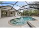Backyard pool with a screened enclosure, providing a clean and private swimming experience at 5452 Montego Ln, Port Charlotte, FL 33981