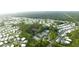 Aerial view of the manufactured home community featuring lush greenery and community amenities at 6642 Acacia Ct, North Port, FL 34287