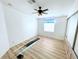 A quaint bedroom space with a ceiling fan and natural light at 6642 Acacia Ct, North Port, FL 34287