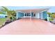 This covered carport boasts ample parking and a charming entrance to the home at 6642 Acacia Ct, North Port, FL 34287
