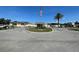 The Holiday Park community center with ample parking and a well-maintained lawn at 6642 Acacia Ct, North Port, FL 34287