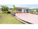 Charming home with a covered carport and landscaped yard at 6642 Acacia Ct, North Port, FL 34287
