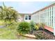 Inviting single-story home with a well-maintained, landscaped yard and ramp access at 6642 Acacia Ct, North Port, FL 34287