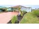 Charming single-story home with a carport and tropical landscaped front yard at 6642 Acacia Ct, North Port, FL 34287