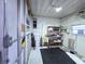 Well-organized garage space with shelving, utility sink, and natural light at 6642 Acacia Ct, North Port, FL 34287