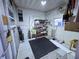 Functional garage space featuring ample storage shelves and utility sink at 6642 Acacia Ct, North Port, FL 34287