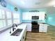 Updated kitchen with stainless appliances and bright counters at 6642 Acacia Ct, North Port, FL 34287