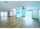 Spacious living room with tile floors and sliding glass door at 6642 Acacia Ct, North Port, FL 34287
