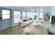 Bright living room featuring stylish furniture, neutral decor, and lots of natural light at 6642 Acacia Ct, North Port, FL 34287