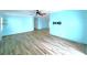 Spacious living room with wood floors and a ceiling fan at 6642 Acacia Ct, North Port, FL 34287