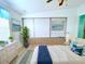 Charming main bedroom with decoratively painted wall, sliding storage, and bright accents at 6642 Acacia Ct, North Port, FL 34287
