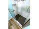 Modern walk-in shower with marble-look tile and grab bar for easy accessibility at 6642 Acacia Ct, North Port, FL 34287