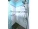 Modern walk-in shower with marble-look tile, dual shower heads, and soap and shampoo niches at 6642 Acacia Ct, North Port, FL 34287