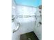 Beautifully tiled shower featuring built-in niches and grab bar for easy accessibility at 6642 Acacia Ct, North Port, FL 34287