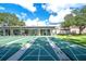 Shuffleboard courts with covered seating surrounded by landscaped grounds at 6642 Acacia Ct, North Port, FL 34287