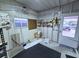Utility room with organized storage shelves, a practical workspace, and a convenient entry at 6642 Acacia Ct, North Port, FL 34287