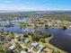 Aerial view of the lake community showcasing the lush landscaping and waterfront homes at 2275 Kenya Ln, Punta Gorda, FL 33983