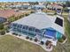 Aerial view of the rear of the property with pool and patio area at 2275 Kenya Ln, Punta Gorda, FL 33983