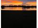 Beautiful sunset over the tranquil lake in the backyard offers a peaceful view at 2275 Kenya Ln, Punta Gorda, FL 33983