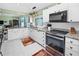 Bright kitchen with stainless steel appliances and granite countertops offers modern style at 2275 Kenya Ln, Punta Gorda, FL 33983