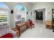 Inviting living area with lots of natural light, shutters, white tile floors, and comfortable seating at 2275 Kenya Ln, Punta Gorda, FL 33983