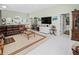 Spacious living room with neutral colors and tile flooring offers a relaxing atmosphere at 2275 Kenya Ln, Punta Gorda, FL 33983