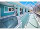 Relaxing screened-in pool with hot tub and covered patio area offers plenty of space at 2275 Kenya Ln, Punta Gorda, FL 33983