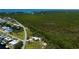 Beautiful home nestled near a tranquil bay, boasting lush greenery and a serene, coastal atmosphere at 24362 Yacht Club Blvd, Punta Gorda, FL 33955