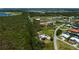 Expansive aerial view showcases a serene community with canal, lush greenery, and beautiful waterway views at 24362 Yacht Club Blvd, Punta Gorda, FL 33955