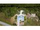 Serene home features a metal roof, spacious yard, canal views, and lush natural surroundings at 24362 Yacht Club Blvd, Punta Gorda, FL 33955