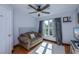 Bright bedroom with a sofa, hardwood flooring, and natural light at 24362 Yacht Club Blvd, Punta Gorda, FL 33955