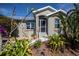 Close-up view of the home's entrance, showcasing the front door, landscaping, and architectural details at 24362 Yacht Club Blvd, Punta Gorda, FL 33955