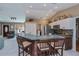 Open concept kitchen featuring a breakfast bar with seating and modern appliances at 24362 Yacht Club Blvd, Punta Gorda, FL 33955