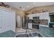 Functional kitchen with stainless steel appliances, ample cabinetry, and plenty of counter space at 24362 Yacht Club Blvd, Punta Gorda, FL 33955