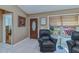 Cozy living area featuring neutral walls, tile flooring, and a sunlit window at 24362 Yacht Club Blvd, Punta Gorda, FL 33955