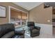 Comfortable living area showcasing tile flooring, cozy seating, and a view of the outdoors at 24362 Yacht Club Blvd, Punta Gorda, FL 33955