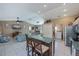 Open floor plan with a combined living room and kitchen featuring white tiled flooring at 24362 Yacht Club Blvd, Punta Gorda, FL 33955